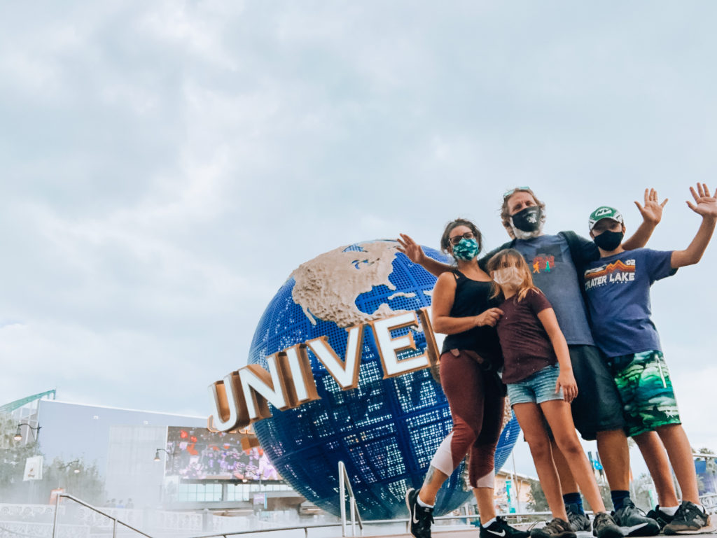 posing in front of Universal Studios